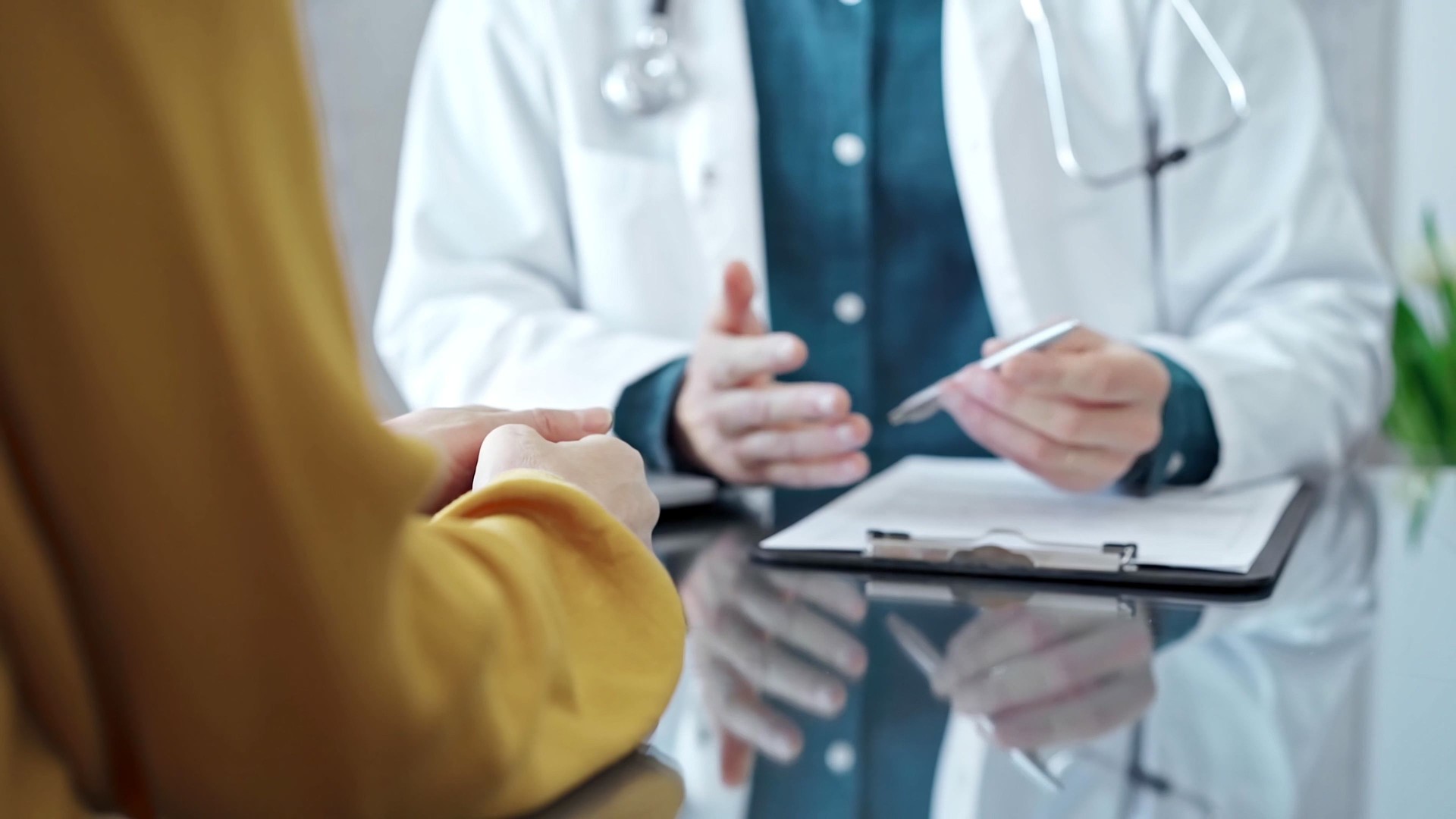 Doctor and patient consultation in clinic. Medicine and health care